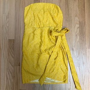 Brand new! Never worn. Yellow Strapless Dress with Tie.